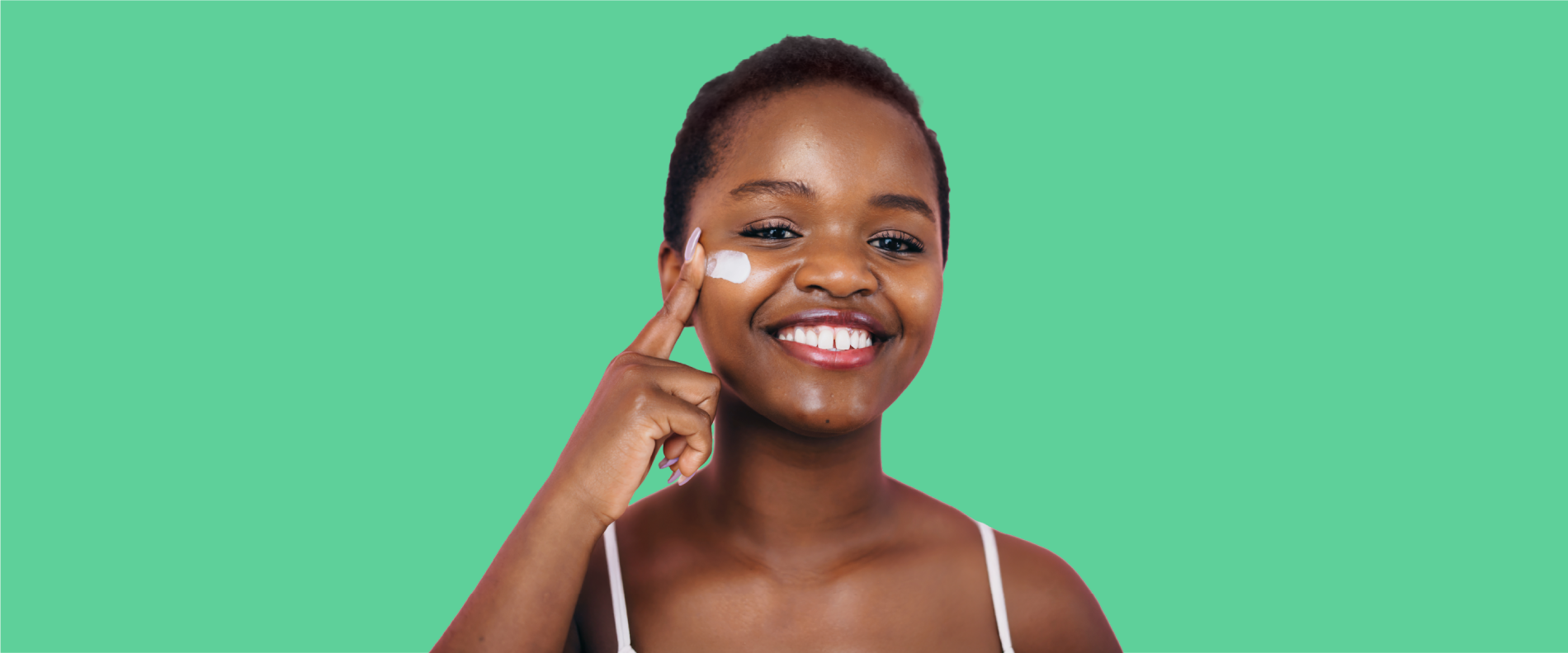 A close-up photo of a person applying TWYNEO cream on their face.