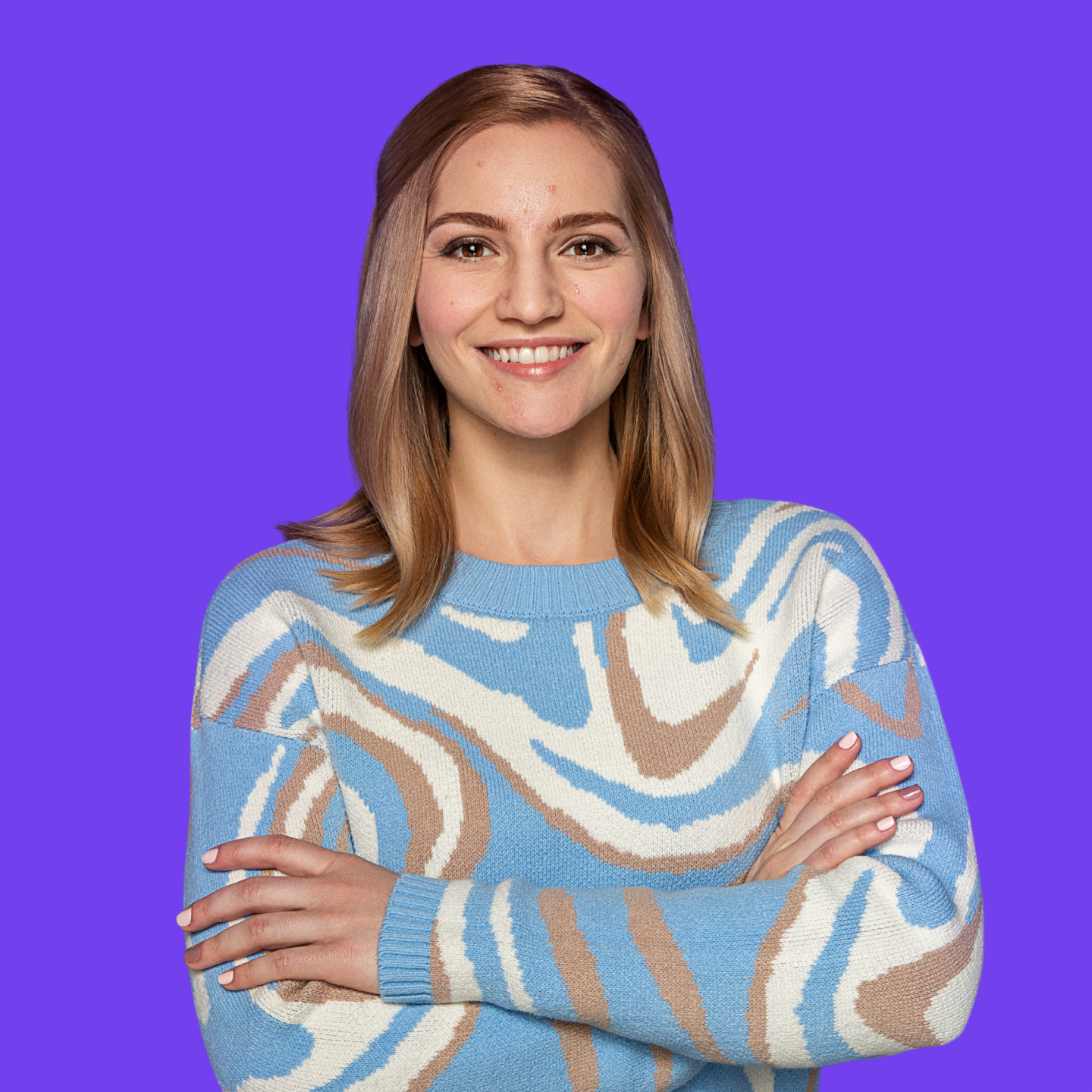 Older female teen with visible acne confidently smiling at camera with arms crossed.