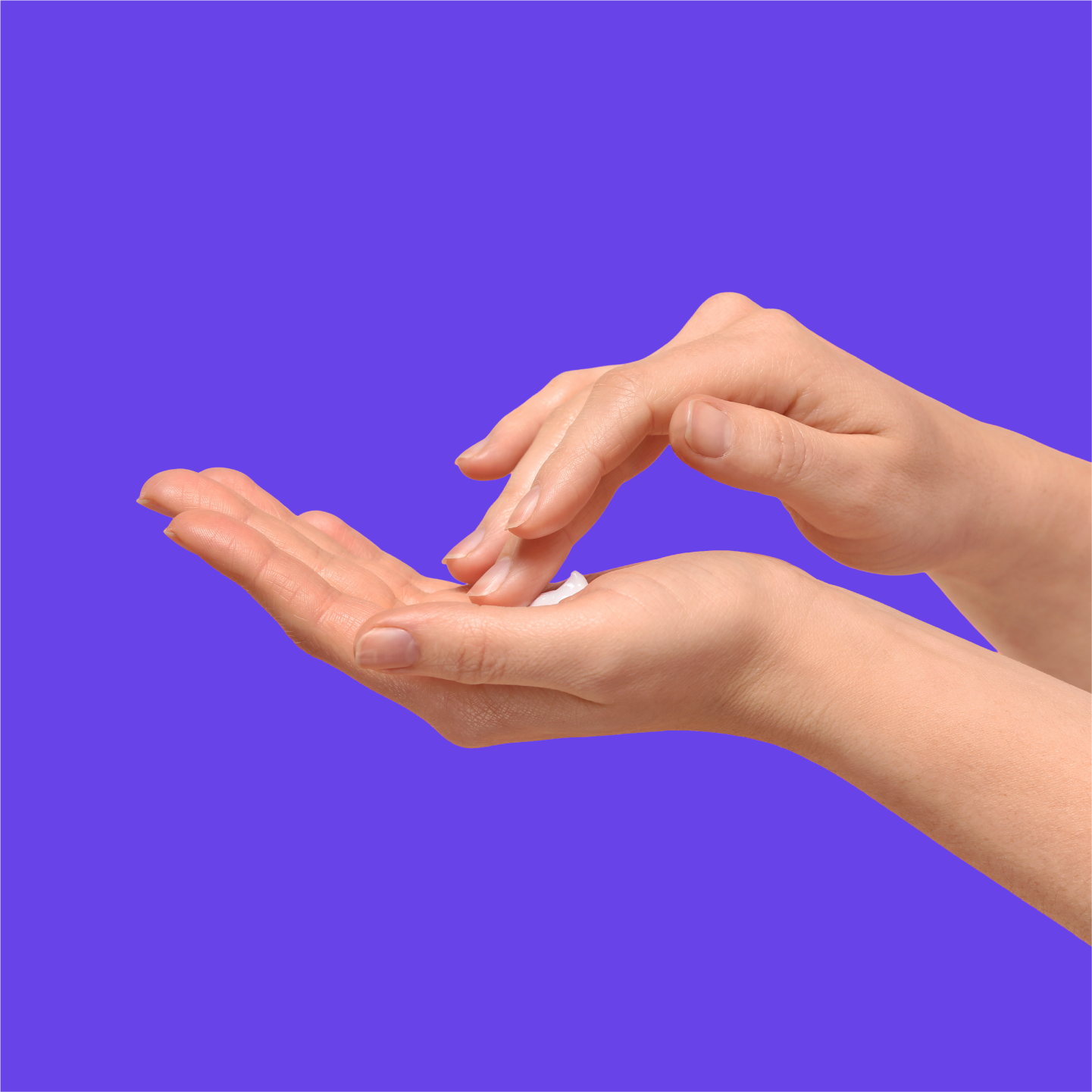 A photo of a hand with a pea-sized amount of TWYNEO cream in their palm.
